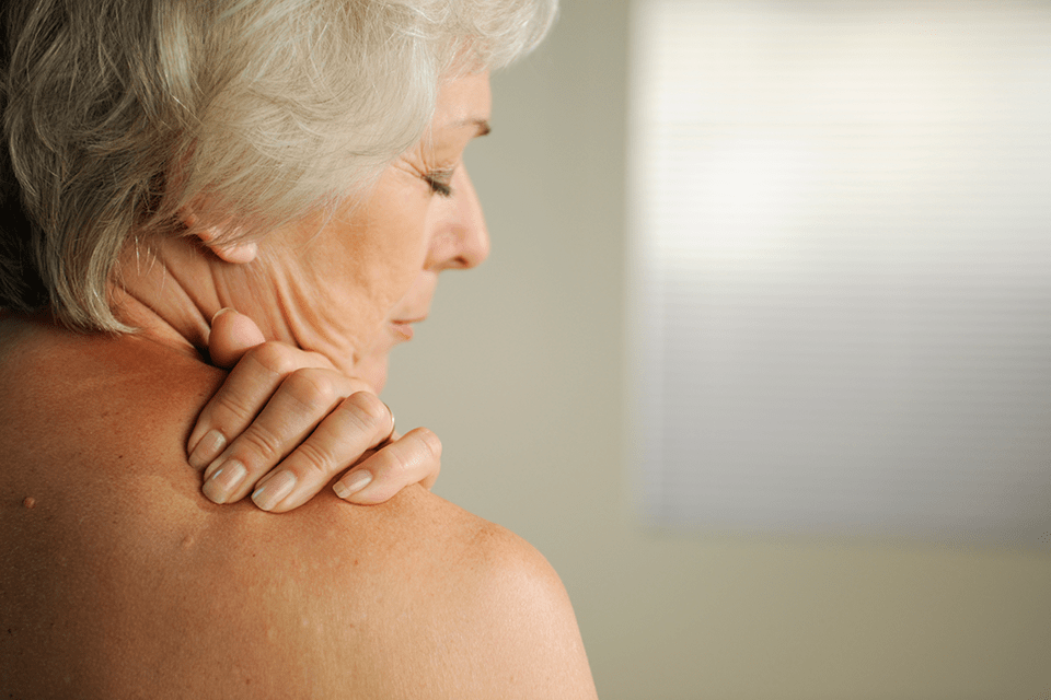 Woman with painful shoulder
